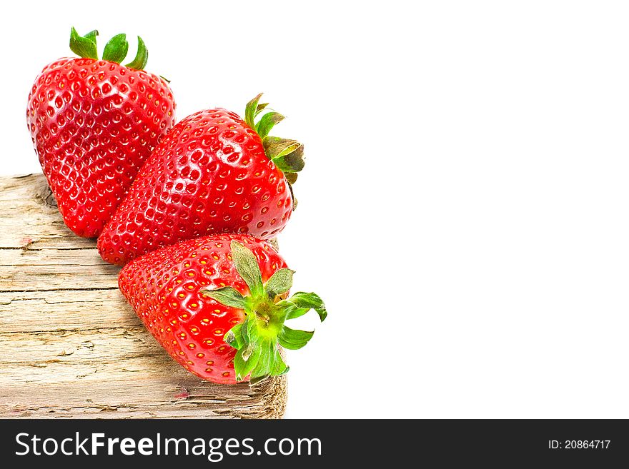 Group of red strawberries on wood