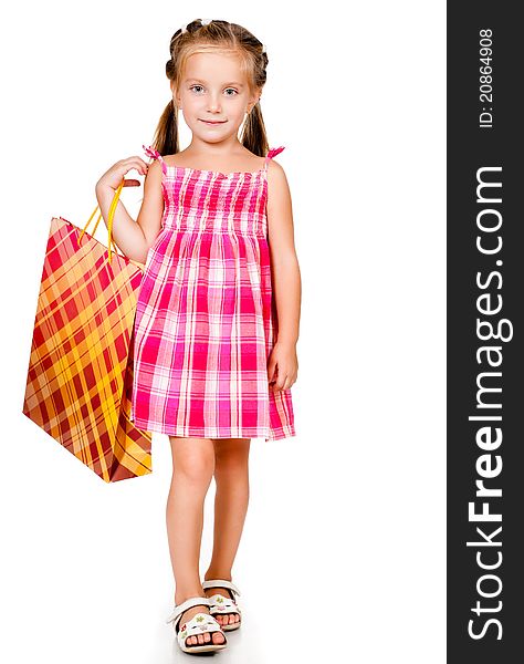 Little girl with the package isolated on a white background