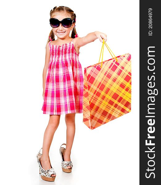 Little girl with the package isolated on a white background