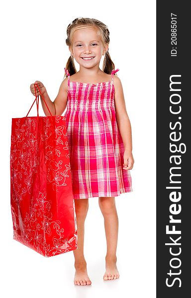 Little girl with the package isolated on a white background