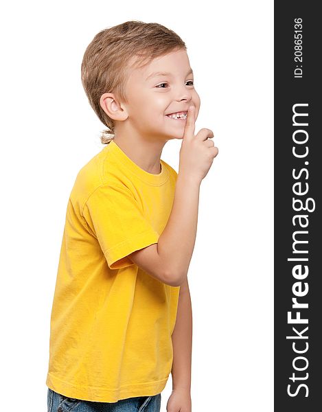 Portrait of beautiful little boy with silence gesture over white background. Portrait of beautiful little boy with silence gesture over white background