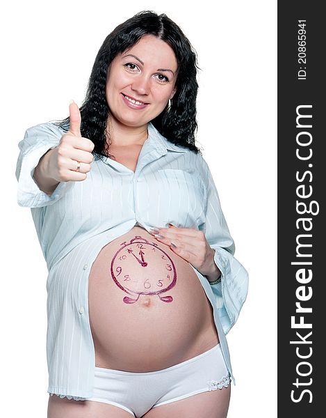 Tummy of pregnant woman with funny drawing over white background. Tummy of pregnant woman with funny drawing over white background