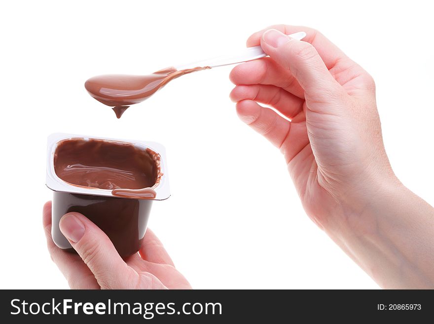 Chocolate dessert and teaspoon isolated on white. Chocolate dessert and teaspoon isolated on white