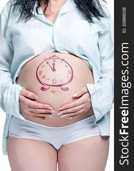 Tummy of pregnant woman with funny drawing over white background. Tummy of pregnant woman with funny drawing over white background