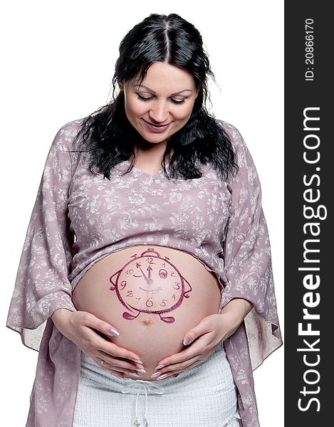 Tummy of pregnant woman with funny drawing over white background. Tummy of pregnant woman with funny drawing over white background