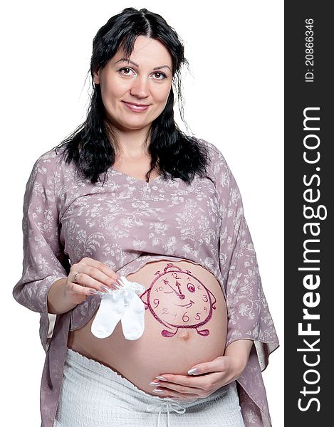 Tummy of pregnant woman with funny drawing over white background. Tummy of pregnant woman with funny drawing over white background