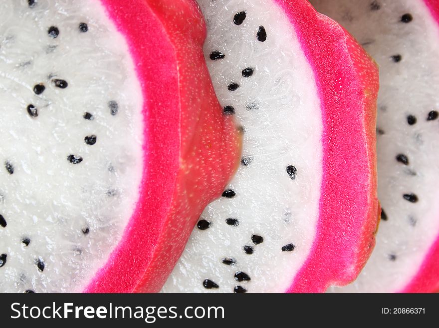 Pink pitahaya dragon fruit background sliced in pieces