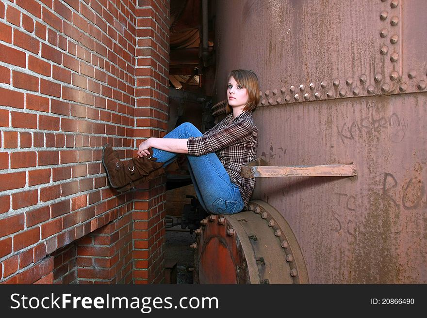 Young woman between a wall and a hard place. Young woman between a wall and a hard place
