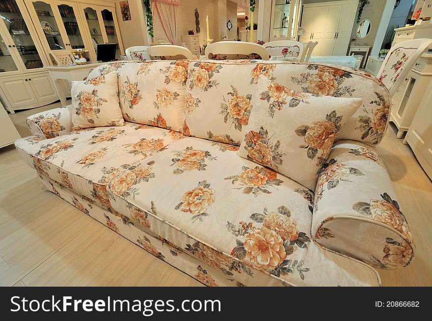 Flowery and comfortable sofa in living room