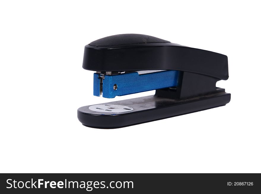 Close up of a stapler on a neutral background