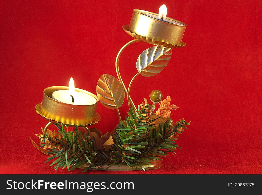 Christmas Candlestick with lighrs over red