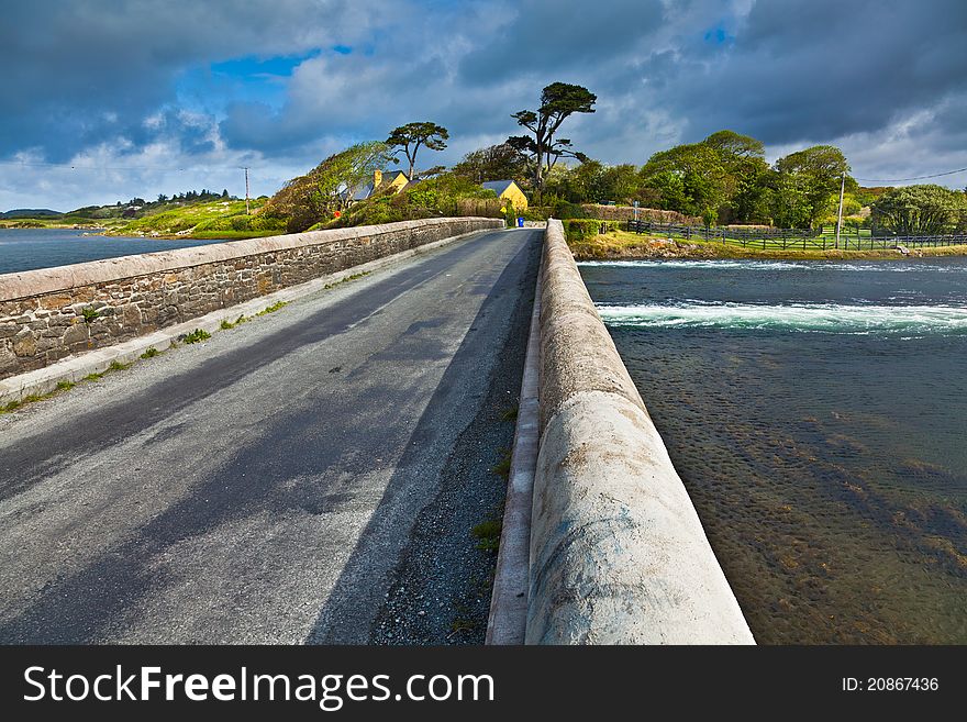 Bridge at Ardmore bay during high tide, county Galway, Ireland.