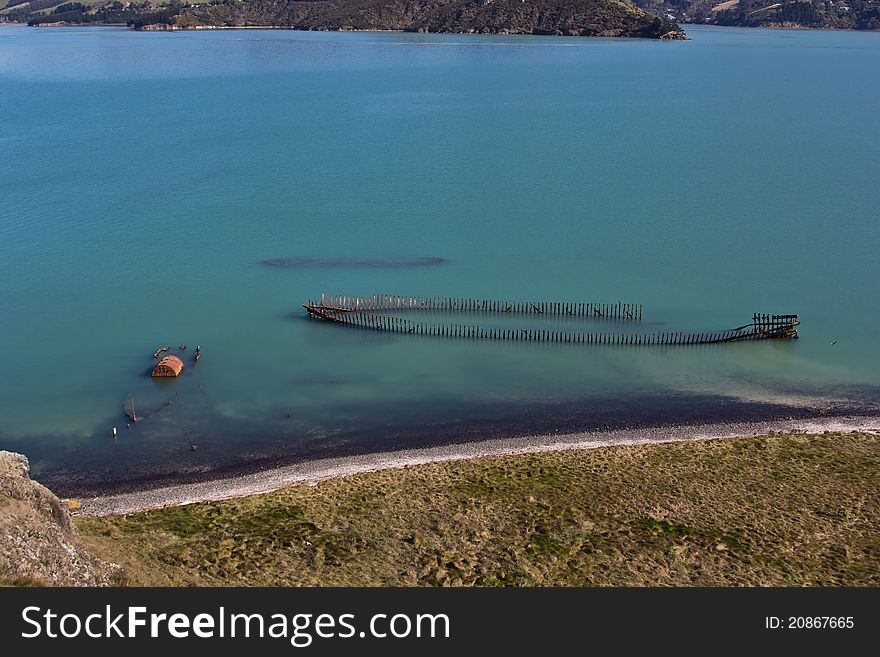 The rusting hulk of a shipwrecks lie off the coast of Quail Island, New Zealand. The rusting hulk of a shipwrecks lie off the coast of Quail Island, New Zealand.