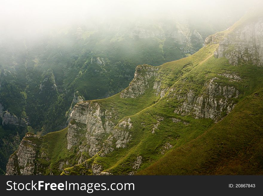 Mountain valley in the mist, Bucegi Mountains, Romania