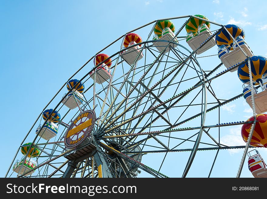 Ferris wheel against sky, view from below. Ferris wheel against sky, view from below.