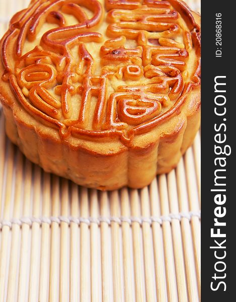 Close up of a Traditional Mooncake supported by a mat