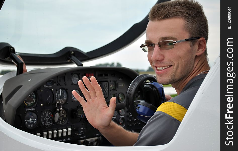 A young man is going to fly into the sky on a small plane