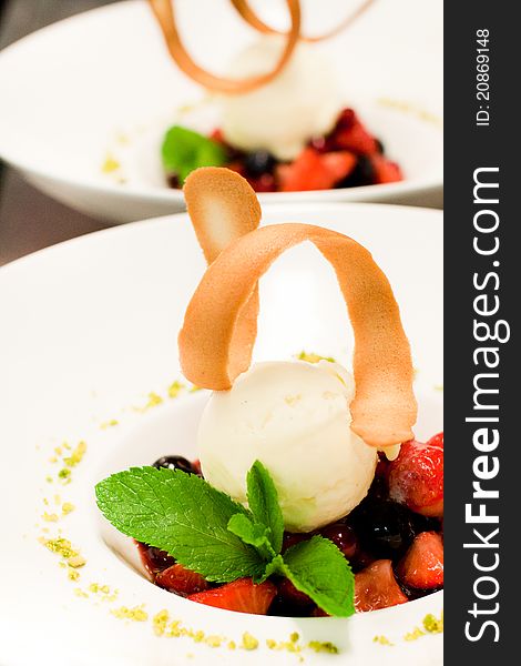 Dessert of forest fruits with vanilla ice-cream. Dessert of forest fruits with vanilla ice-cream