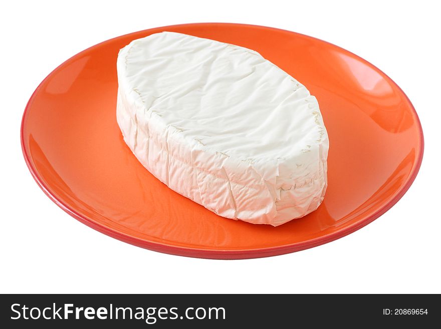 Cheese on an orange plate. Cheese on an orange plate