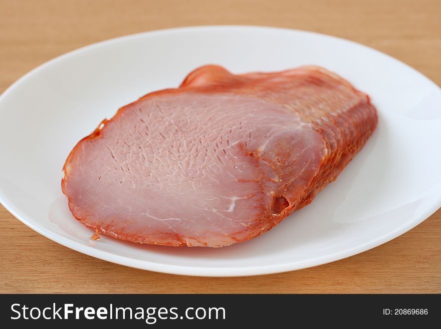 Ham on an white plate. Ham on an white plate