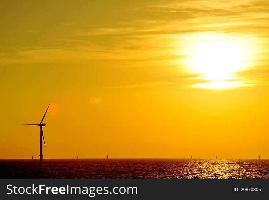 Sunset taken from Greater Gabbard Offshore Wind farm with complete turbine in foreground and part complete in background. Sunset taken from Greater Gabbard Offshore Wind farm with complete turbine in foreground and part complete in background