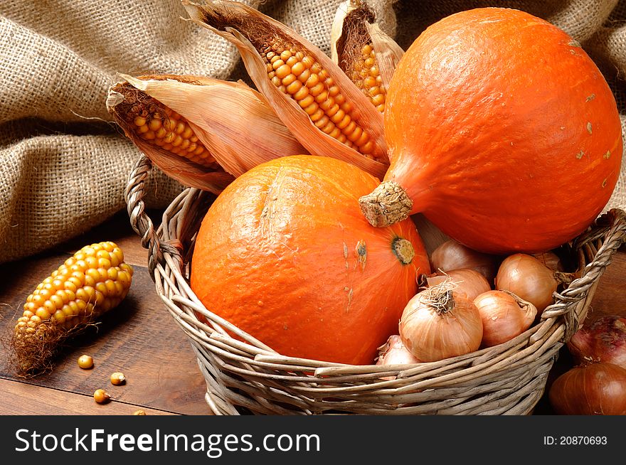 Fall basket full of pumpkins and vegetables. Fall basket full of pumpkins and vegetables
