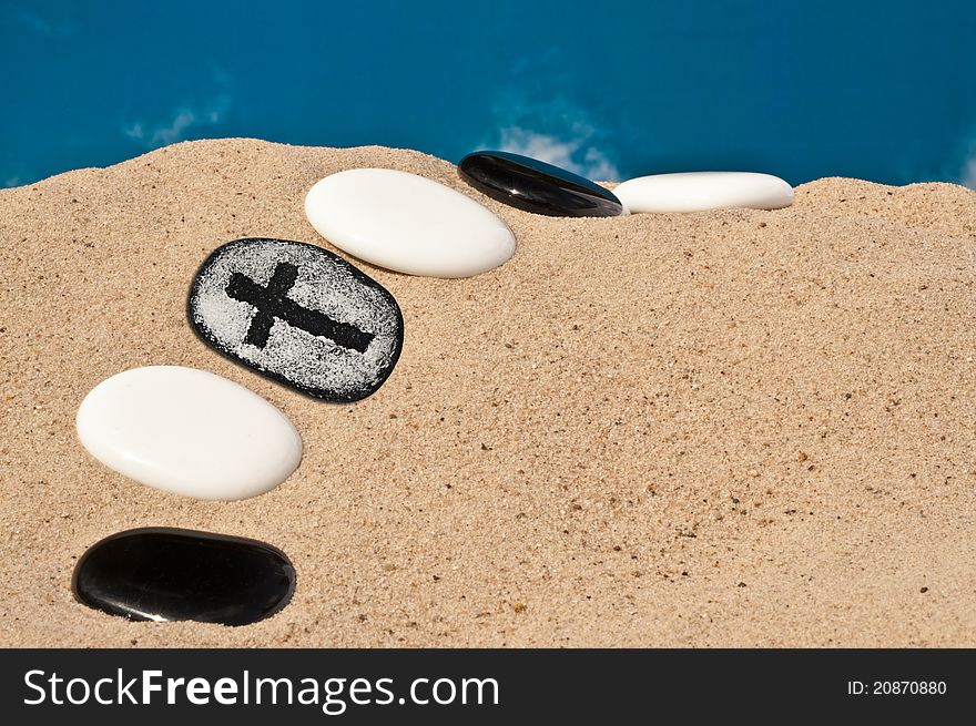 Stone pathway in desert with cross