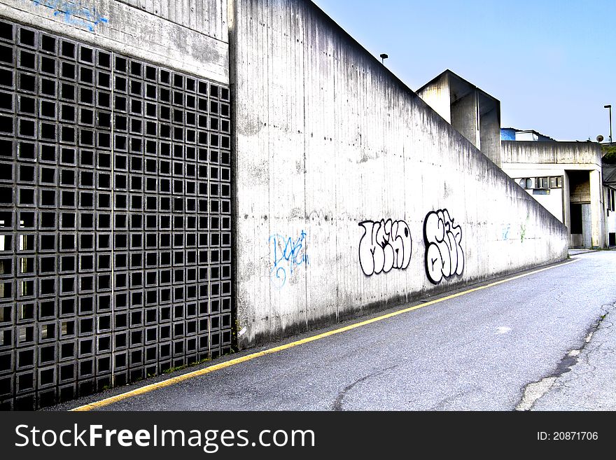 Graffiti on concrete wall along the. Graffiti on concrete wall along the