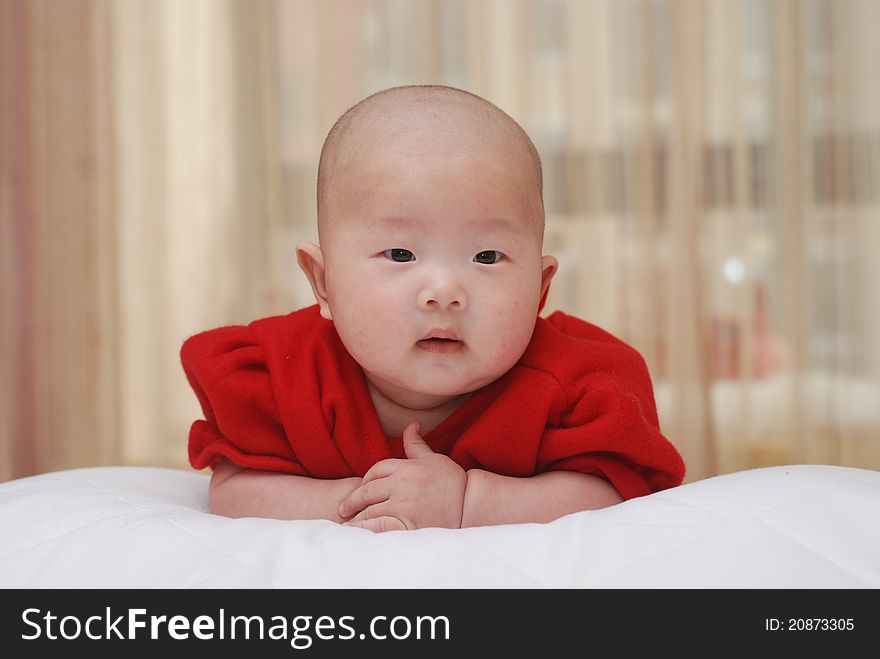 An adorable Chinese baby, under 1 year old. An adorable Chinese baby, under 1 year old