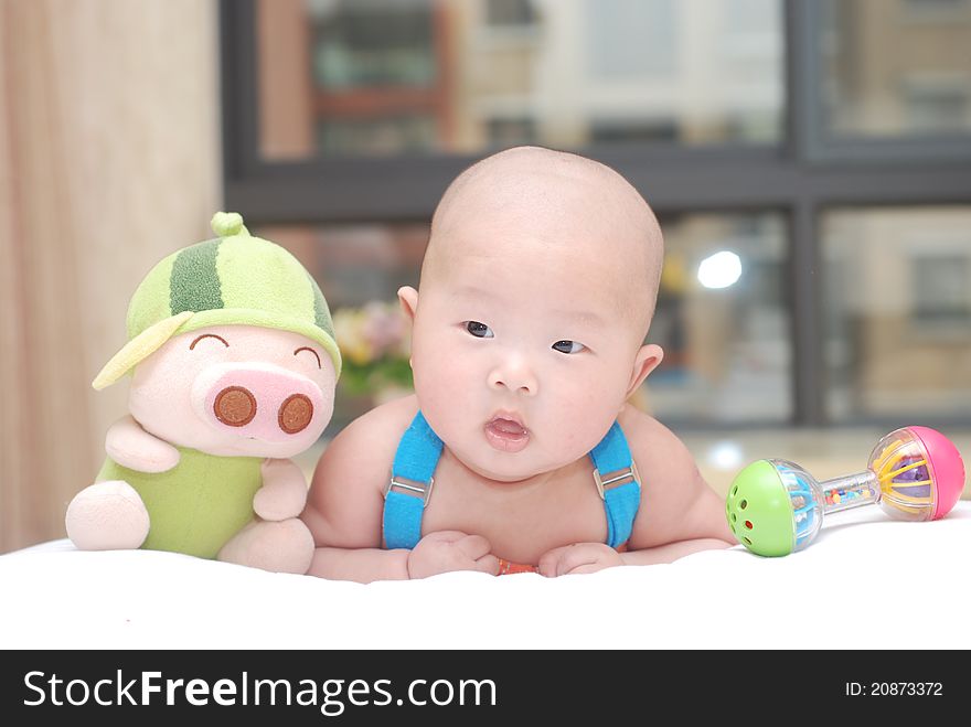 An adorable Chinese baby, under 1 year old. An adorable Chinese baby, under 1 year old