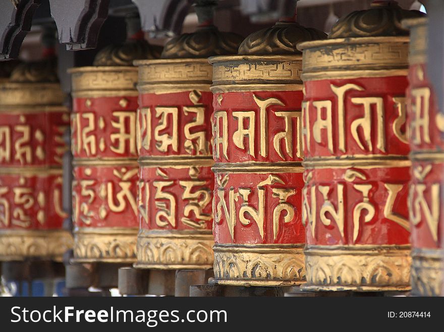 A row of buddhist prayer wheels used in tibetian buddhism.