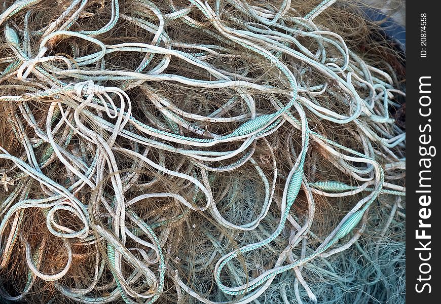 Details of fishing nets in close view in a fishermen port