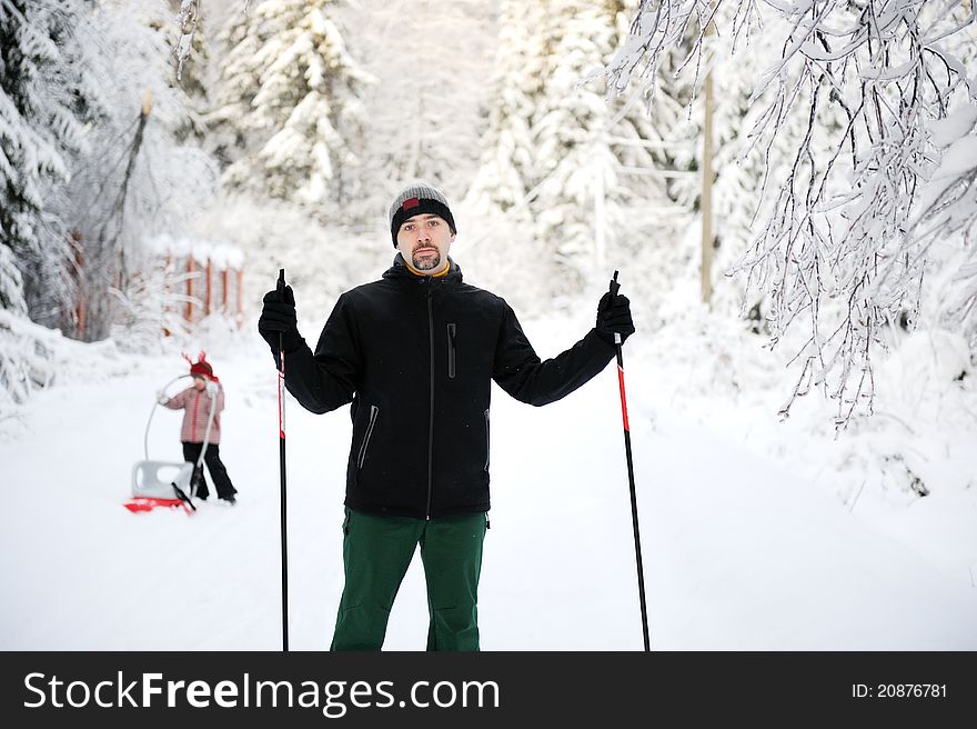 Young father and his daughter enjoy nice winter day. Young father and his daughter enjoy nice winter day