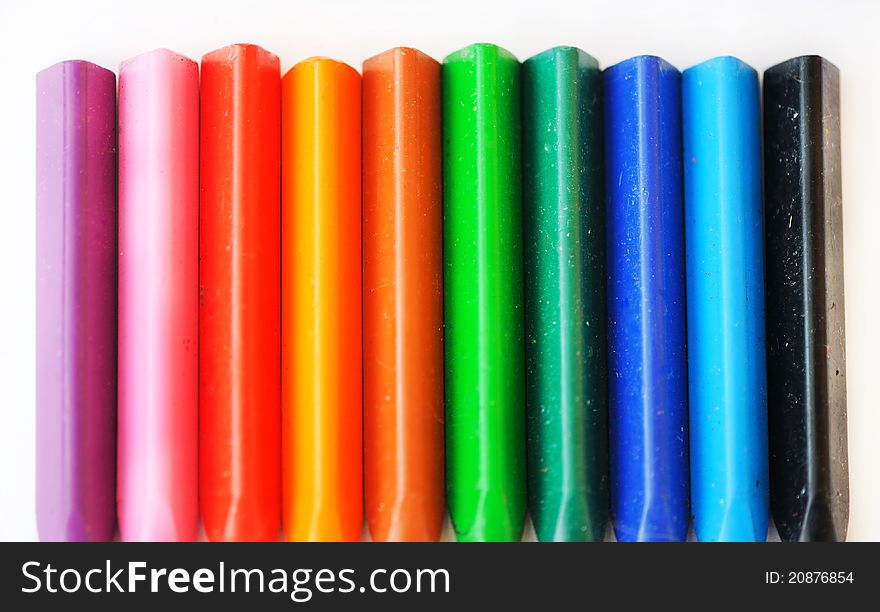 Collection of colored chalks on a white background