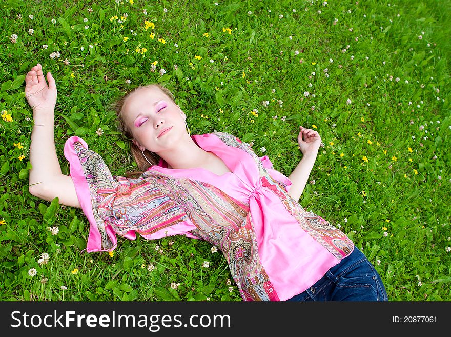 Portrait of a beautiful young woman on the meadow, summer. Portrait of a beautiful young woman on the meadow, summer