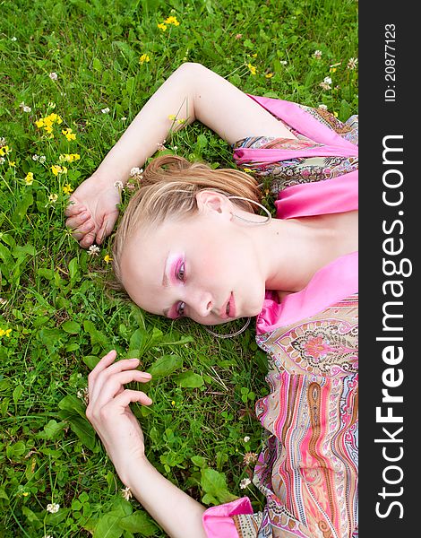 Portrait of a beautiful  woman on the meadow, summer