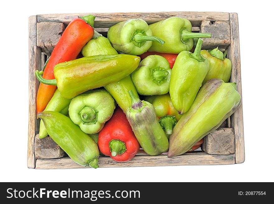 Box with peppers. Heap peppers on a white background. Box with peppers. Heap peppers on a white background.