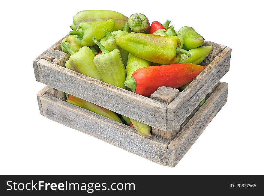 Box with peppers. Heap peppers on a white background.