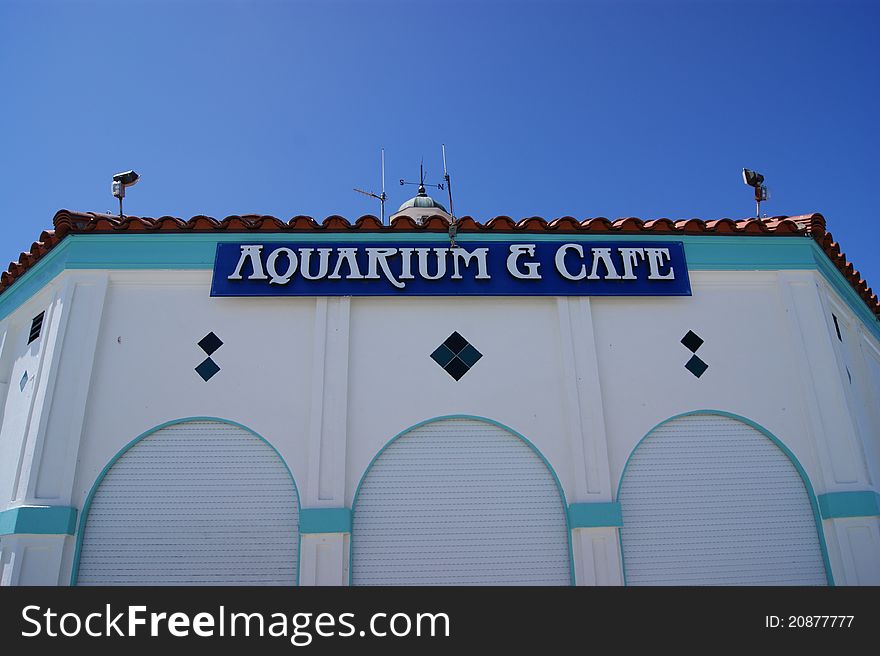 An aquarium and cafe at the end of a pier on the west coast of America.