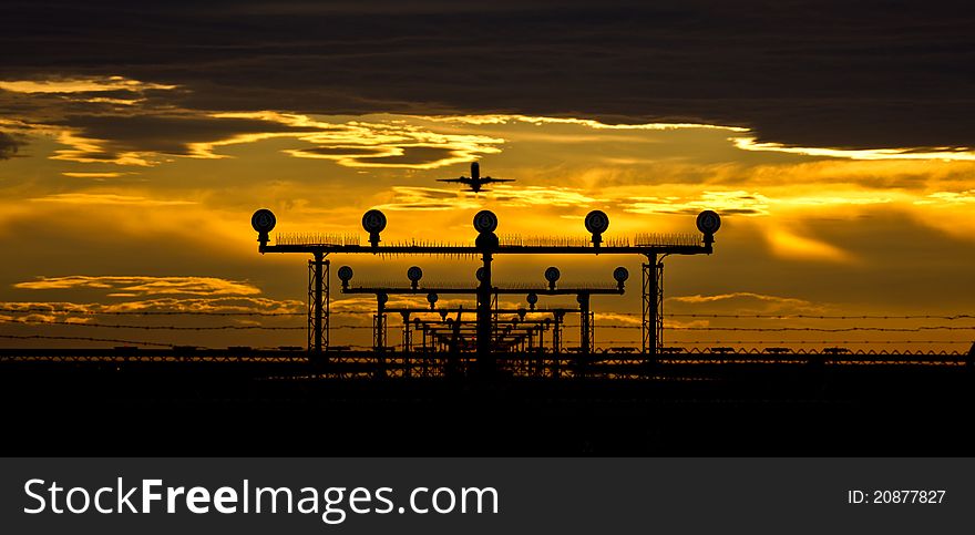 Airport runway,fence and aircraft at dusk. Airport runway,fence and aircraft at dusk.