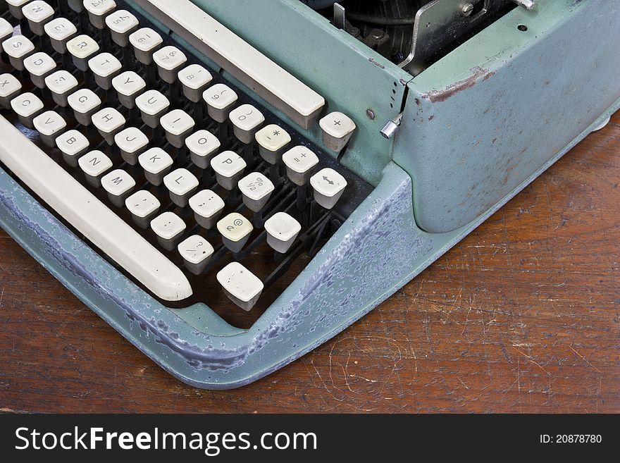 Old type device keyboard on old wooden table