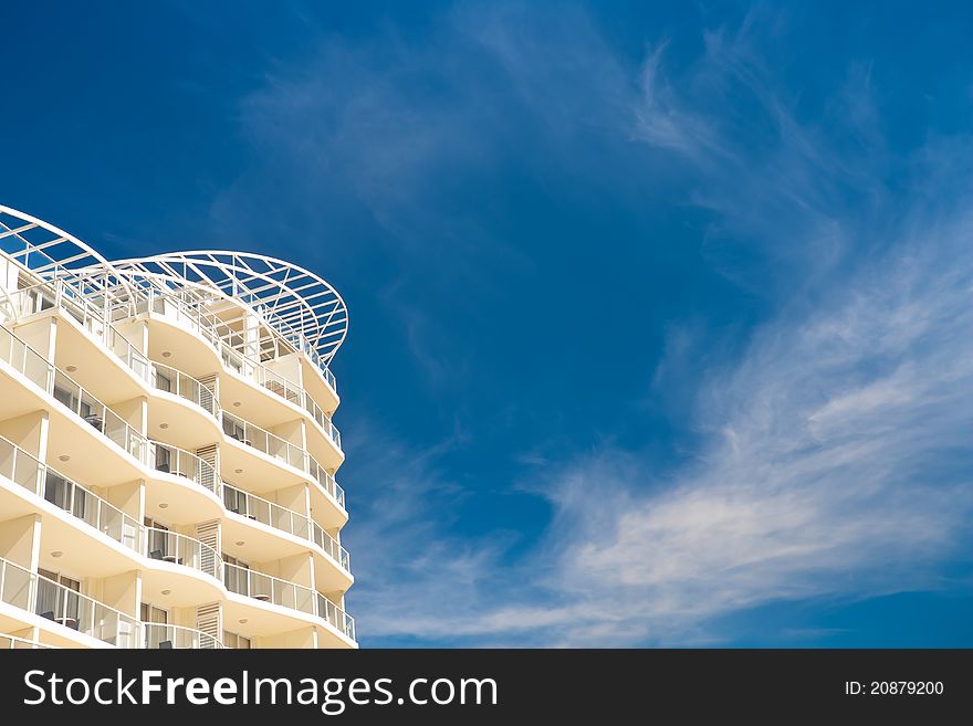 Contemporary hotel on a background of blue sky. Contemporary hotel on a background of blue sky