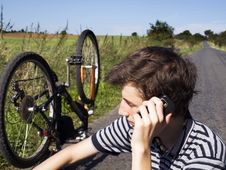 Young Cyclist Calling For Help Royalty Free Stock Image Young Cyclist Calling For Help Royalty Free Stock Image
