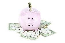 Piggy Bank, Cash And Medicine Royalty Free Stock Photography