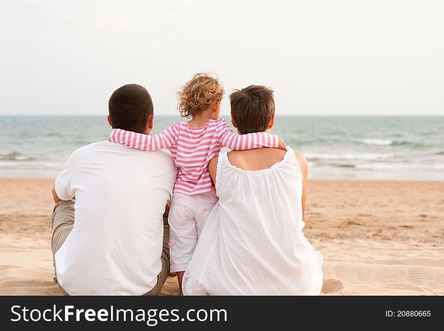 Family With Child On The Beach