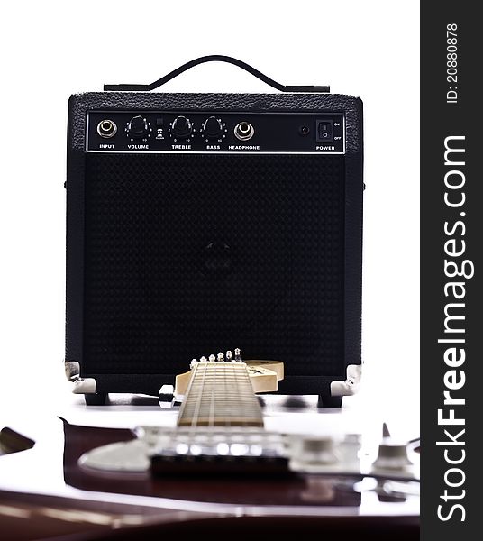 Electric guitar and amplifier isolated on the white backgroud with retro look