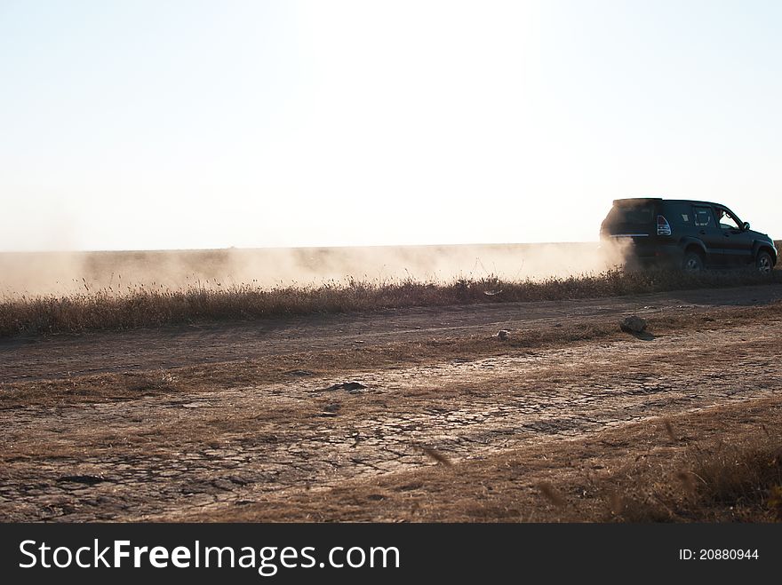 Outlander driving offroad in desert road