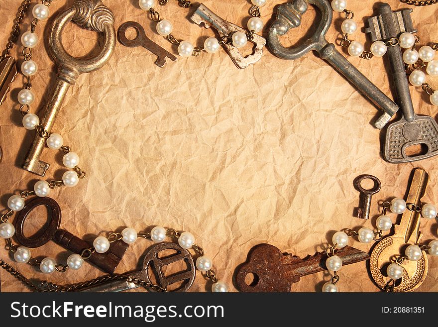 Blank sheet of crumpled paper, framed different old keys. Blank sheet of crumpled paper, framed different old keys