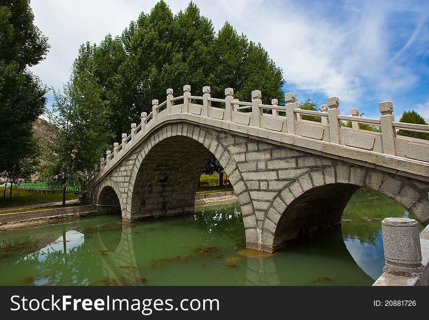 A chinese style stone bridge in the The Lhasa, Tibet