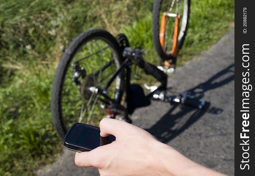 Young cyclist calling for help on the road